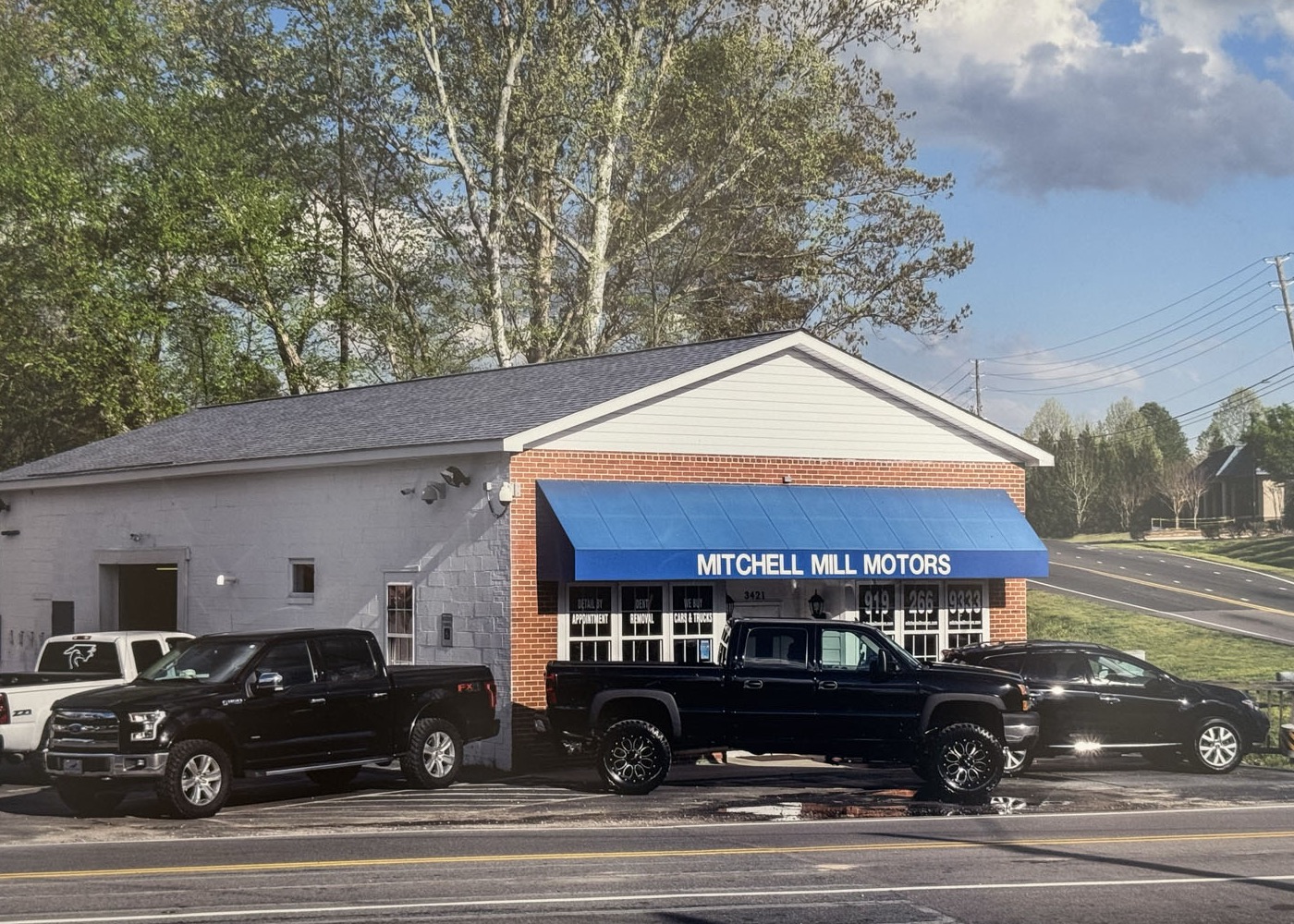 The Mitchell Mill Motors sales building on Forestville Rd
